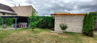 a small shed in a yard next to a building at Za hrází Poděbrady in Poděbrady