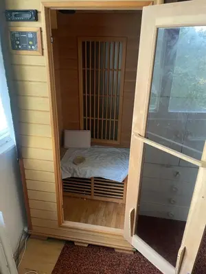 a small wooden cage with a bed in it at HANDY FLAT WITH SAUNA and TUBE-UBahn in Prague