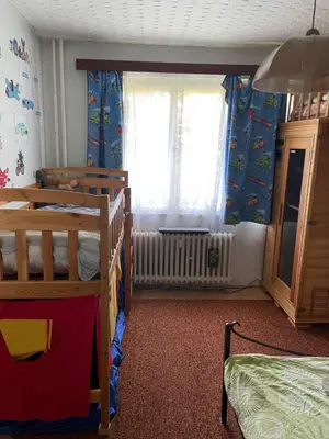 a bedroom with two bunk beds and a window at HANDY FLAT WITH SAUNA and TUBE-UBahn in Prague