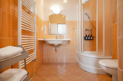 a hallway with a door open to a room at Heart of the City Studio in Prague
