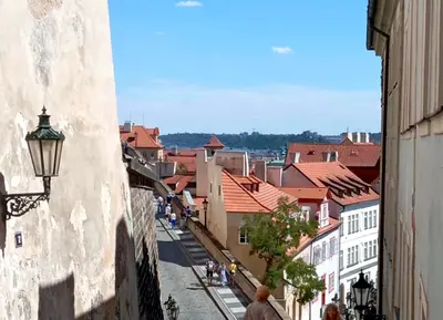 a view of a city from a street with buildings at Prague centrum apartment Hradčany in Prague