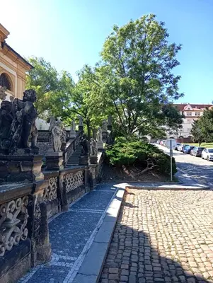 a stone walkway with statues on a bridge at Prague centrum apartment Hradčany in Prague
