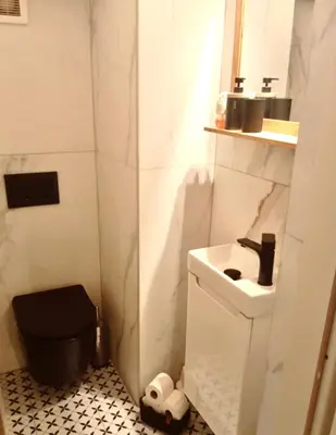 a small bathroom with a sink and a toilet at Prague centrum apartment Hradčany in Prague