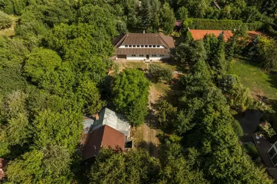 an aerial view of a house in the forest at Strom času