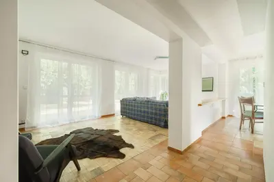 a living room with a couch and a table at Strom času