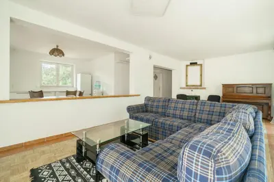 a living room with two couches and a table at Strom času