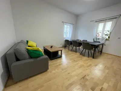 a living room with a couch and a table at Living in Prague 1 in Prague