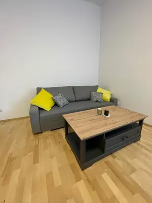 a living room with a couch and a coffee table at Living in Prague 1 in Prague