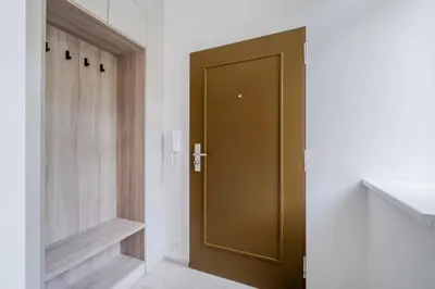 a bathroom with a green door in a room at Blueground Nusle balcony nr Vysehrad PRG-72 in Prague