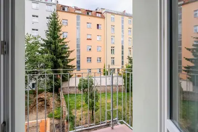 a window with a view of a building at Blueground Nusle balcony nr Vysehrad PRG-64 in Prague