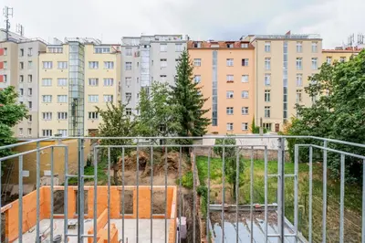 a view of a city with buildings in the background at Blueground Nusle balcony nr Vysehrad PRG-64 in Prague