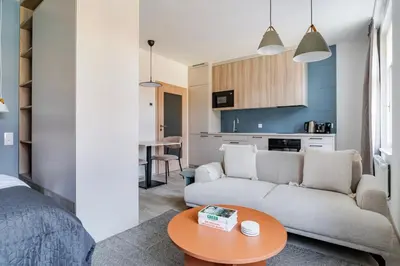 a living room with a couch and a table at Blueground Nusle view nr Vyšehrad PRG-70 in Prague