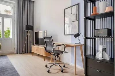 a home office with a desk and a chair at Blueground Vinohrady balcony nr Riegrovy Sady PRG-78 in Prague