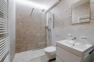 a bathroom with a toilet and a sink and a shower at Blueground Nusle city view nr Vysehrad PRG-62 in Prague