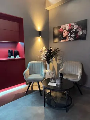 a waiting room with two chairs and a table at SPA SPA Karlín in Prague