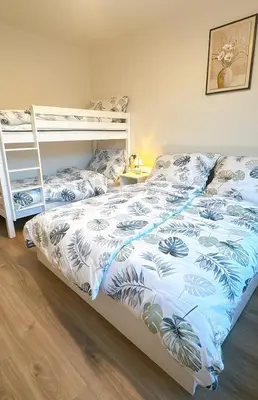 a bedroom with a bed and a bunk bed at New Apartment Prague 5 in Prague