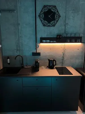 a kitchen with a sink and a counter top at SPA SPA Smíchov - Graff in Prague