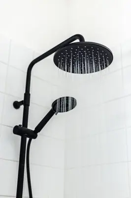 a shower head with a bunch of hair brushes at Prague Jungle Studio in Prague