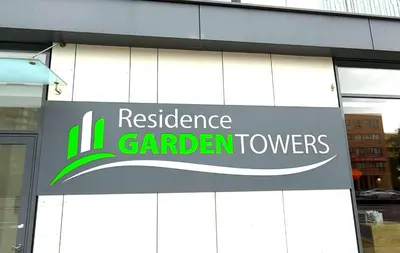 a sign that reads resilience garden towers on the side of a building at Garden Residence Terrace Apartment in Prague