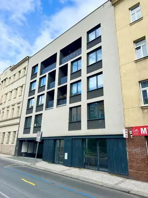 an apartment building on a city street at Modern two-storey apartment with terrace in Prague