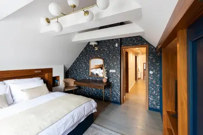 a bedroom with a bed and a mirror on the wall at Residence Sodomov