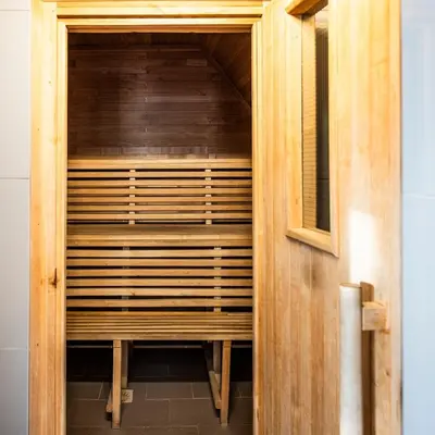 a wooden sauna is shown in a room at Residence Sodomov