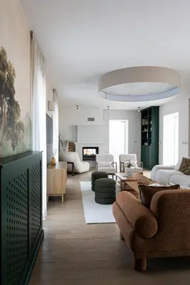 a living room with couches and chairs and a fireplace at Residence Sodomov