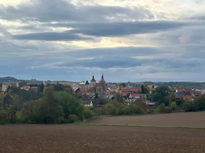 a view of a city from a field with a town at Ubytování uprostřed Evropy in Kouřim