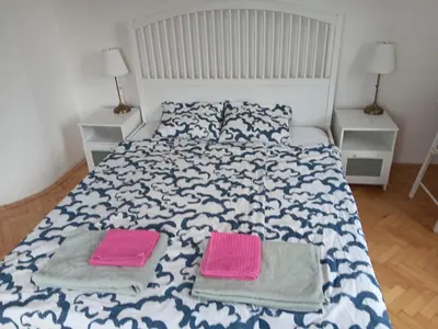 a bedroom with a bed with two towels on it at Cosy appartment close to main train station and city center in Prague