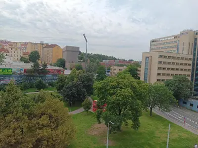 a view of a city with trees and buildings at Cosy appartment close to main train station and city center in Prague