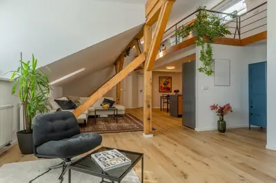 an open living room with a loft at Parkview Penthouse in Prague