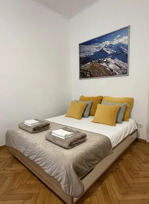 a bedroom with a large bed in a room at Cozy Prague Apartment in Prague