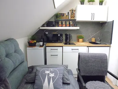 a small bathroom with a toilet and a mirror at Cozy Studio on Metro in Prague