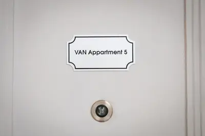 a sign on a door that reads van appointment at Apartment Spalená in Prague