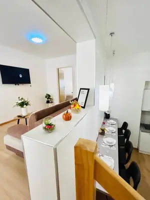 a living room with a table and a couch at A newly renovated Apartment the heart of Prague in Prague