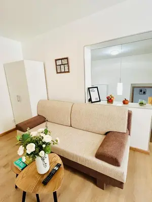 a living room with a couch and a table at A newly renovated Apartment the heart of Prague in Prague
