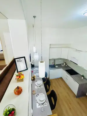 a kitchen with a long table with food on it at A newly renovated Apartment the heart of Prague in Prague
