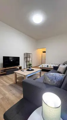 a living room with a couch and a table at Apartmnet near IP Pavlova in Prague