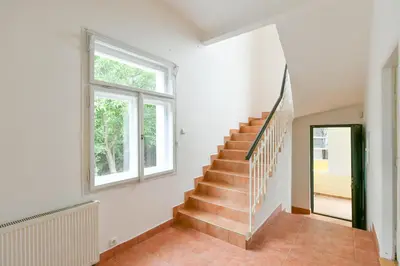 a staircase in a house with a window at Private House with Sauna, Jacuzzi and Hawaiian Hothouse Spa in Velvary