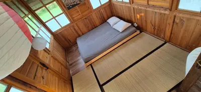 an overhead view of a bed in a room with windows at Private House with Sauna, Jacuzzi and Hawaiian Hothouse Spa in Velvary