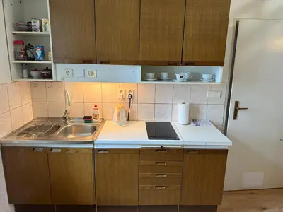 a kitchen with a sink and a counter top at Prague charming flat old Vinohrady in Prague