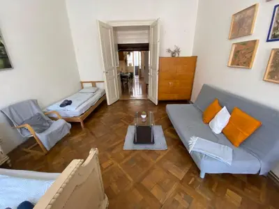 a living room with a couch and a table at Prague charming flat old Vinohrady in Prague
