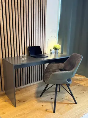 a desk with a laptop and a chair at Prague's Bohemian Grey in Prague