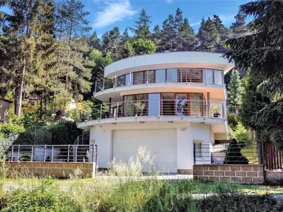 a large white house with a garage at Apartment U Rybníka by Interhome in Stříbrná Skalice