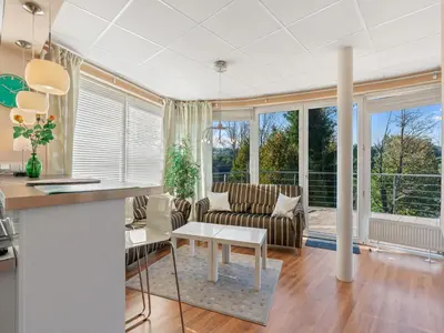 a living room with a couch and a table at Apartment U Rybníka by Interhome in Stříbrná Skalice