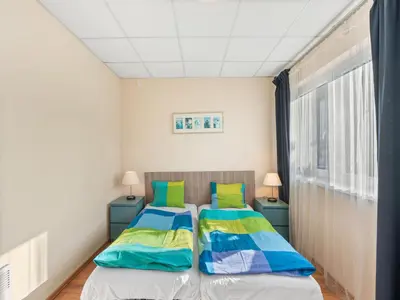 two beds in a small room with a window at Apartment U Rybníka by Interhome in Stříbrná Skalice