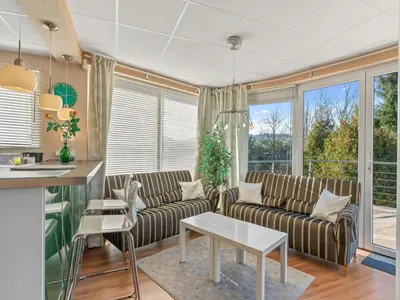 a living room with a couch and a table at Apartment U Rybníka by Interhome in Stříbrná Skalice