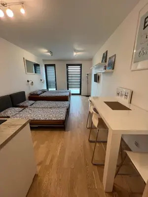 a large living room with a couch and a table at New brand studio in Prag with parking in Prague