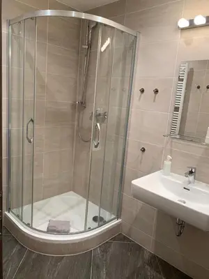 a bathroom with a shower and a sink at New brand studio in Prag with parking in Prague
