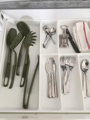a white tray with utensils in a drawer at New brand studio in Prag with parking in Prague